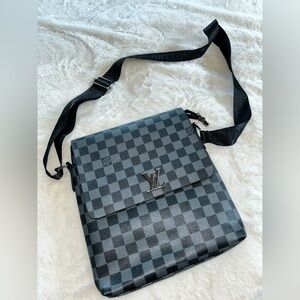 Louis Vuitton District PM
(Damier Graphite) messenger bag.